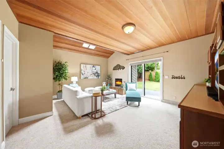 Lower-level bonus room with built in entertainment center & patio access