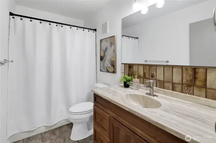 Main full bathroom located on the main level Main full bathroom located on the main level