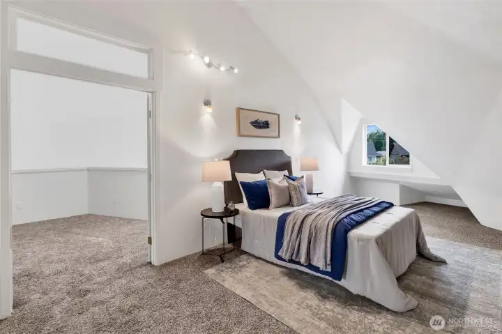 A light-filled upper-level primary suite featuring a full ensuite bath, elegant French doors, and a cozy loft—creating a peaceful retreat with flexible living space. A light-filled upper-level primary suite featuring a full ensuite bath, elegant French doors, and a cozy loft—creating a peaceful retreat with flexible living space.
