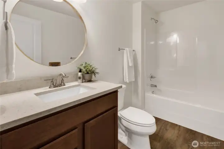 The lower level features its own full convenient bathroom, enhancing flexibility for multigenerational living, guests, or a separate living area. The lower level features its own full convenient bathroom, enhancing flexibility for multigenerational living, guests, or a separate living area.