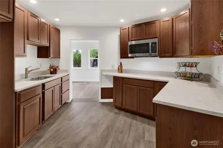 The convenient lower-level kitchenette enhances the versatility of the home, offering added functionality for entertaining, extended family, guests, or flexible living arrangements. The convenient lower-level kitchenette enhances the versatility of the home, offering added functionality for entertaining, extended family, guests, or flexible living arrangements.