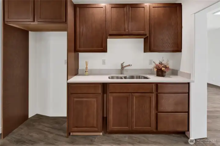 Thoughtfully designed kitchenette enhances the versatility of the lower level, making it well suited for guests, extended family, or additional living space. Thoughtfully designed kitchenette enhances the versatility of the lower level, making it well suited for guests, extended family, or additional living space.