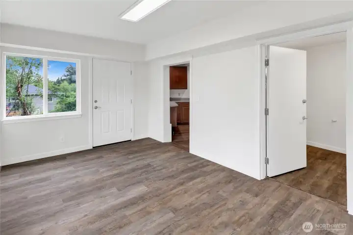 Separate lower-level entry welcomes you into a bright and inviting sunroom surrounded by expansive windows. Separate lower-level entry welcomes you into a bright and inviting sunroom surrounded by expansive windows.