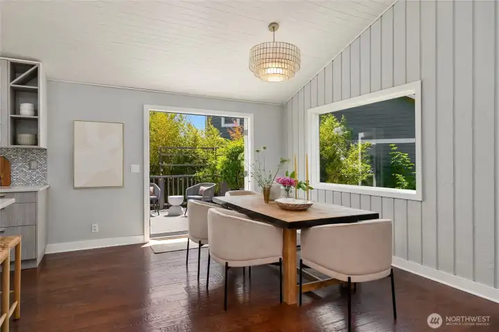 Dining room that has french doors that open to the upper deck.