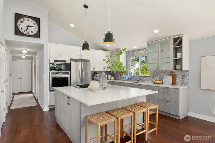 Spacious kitchen with a large inviting island with quartz counters. Perfect for entertaining!