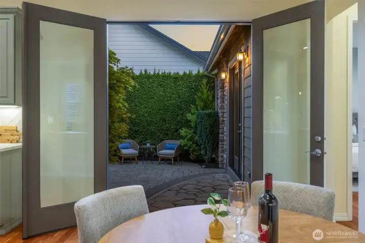 Large French doors open to the private courtyard patio, perfect for entertaining Large French doors open to the private courtyard patio, perfect for entertaining