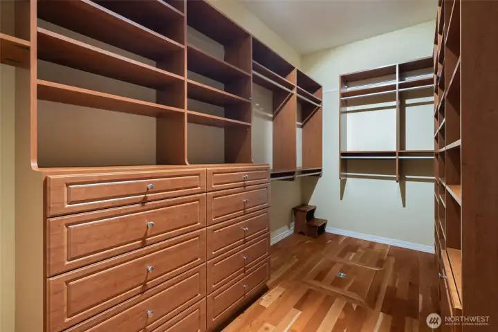 Spacious, updated primary closet, with walls of built-ins Spacious, updated primary closet, with walls of built-ins