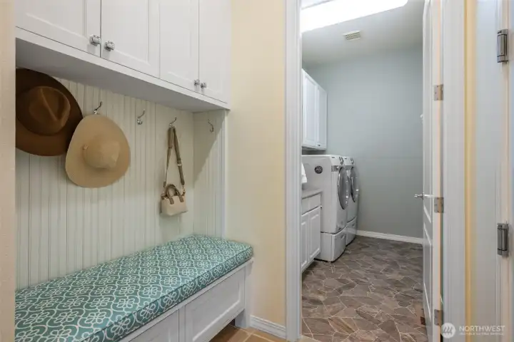 Practical storage & bench located off the garage & laundry room Practical storage & bench located off the garage & laundry room