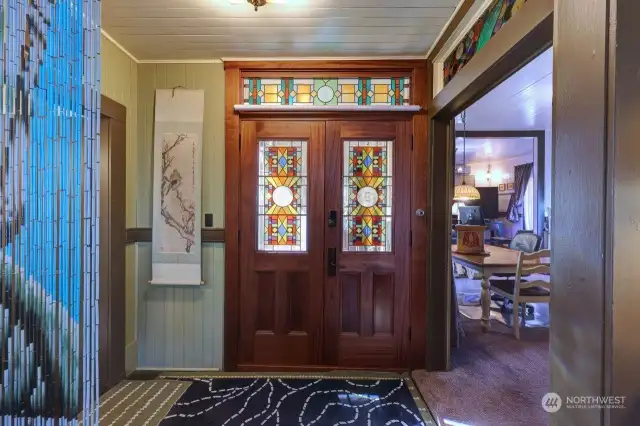 double door with custom stained glass to back porch