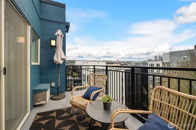 Large private balcony with views of the city on main level