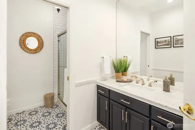 Updated three-quarter bath on the main floor.