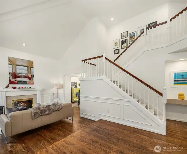 Stunning hardwood floors and vaulted ceilings greet you upon entry, setting the tone for the style of the rest of the house.