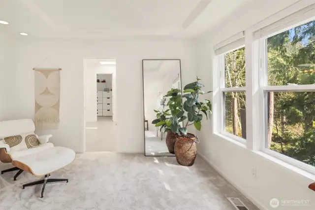 The other end of the primary bedroom - such a cute little sitting area. Room for a vanity, or a Peloton bike. So many options on how to use this space