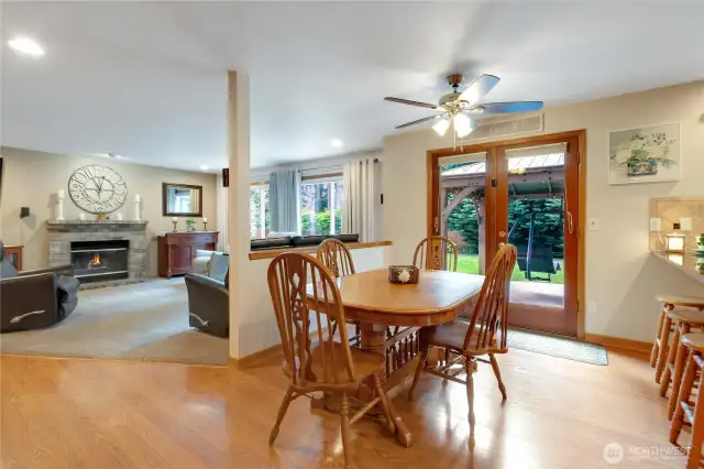 Charming eating nook situated between the kitchen and family room, featuring French doors with direct access to the beautiful backyard, creating a seamless indoor-outdoor dining experience.