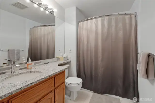 Upstairs hall bathroom conveniently serves all bedrooms, offering practical and accessible amenities