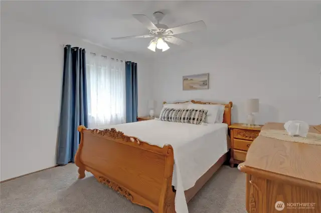 Comfortable bedroom offering ample space and natural light, adaptable to your personal needs.