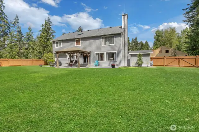 Situated on a just shy half-acre lot, the fully fenced yard offers exceptional privacy and space—perfect for entertaining, outdoor dining, and enjoying year-round gatherings.