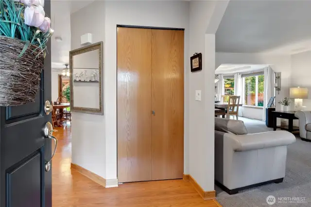 Welcoming entry w/neutral tones, and natural light flowing from the open living and dining areas. Spacious coat closet adds function and convenience.