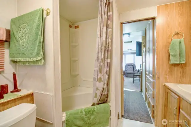 Full bathroom with storage space