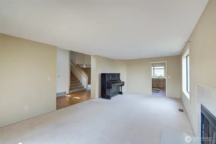 Living room with entrance to kitchen