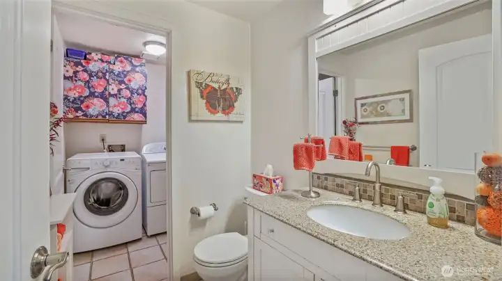 Convenient 3/4 bath on the main floor with direct access to the laundry room - Washer & Dryer stay!