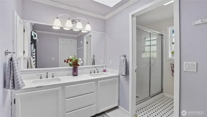 Enjoy a 3/4 bath en suite featuring a double vanity-offering both space and comfort in your private retreat.