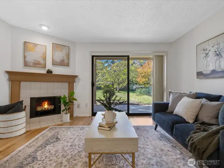 The spacious living room features a wood burning fireplace for cozy evenings and has an open view of the beautiful grounds through doors to the covered patio. This home is in excellent condition, freshly painted and truly ready to enjoy.