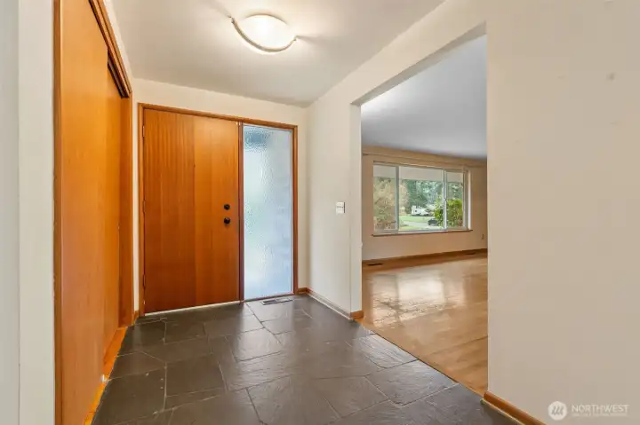 Beautiful inviting entrance with original slate floor.