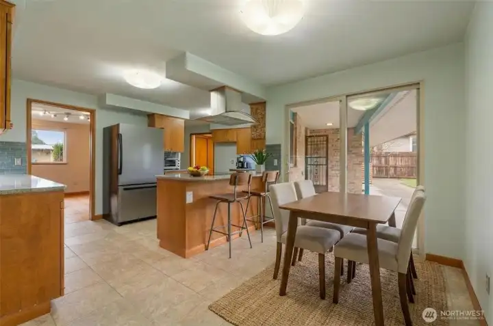 Virtually Staged. Breakfast area leading to covered patio for year round outdoor space.