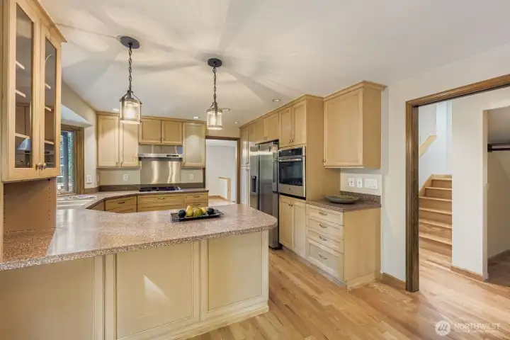 The kitchen is a chef's delight with Corian countertops, abundant cabinetry and a stainless steel appliance package with Miele dishwasher.