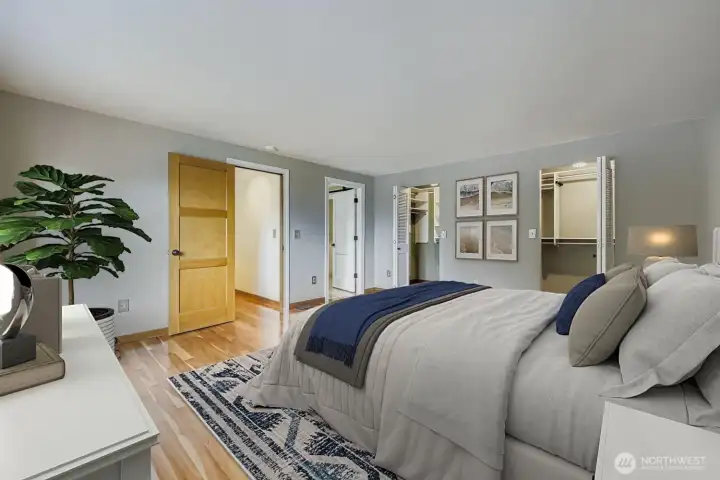 Hardwood flooring continues into the Primary Suite and the other 3 bedrooms. Two separate doors lead into the large custom closet with organizers.