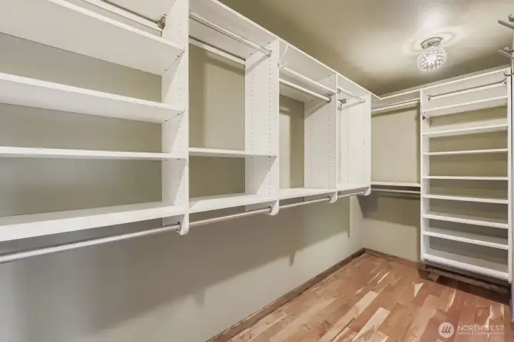 Another view of the large custom-designed closet with a two-door entry.
