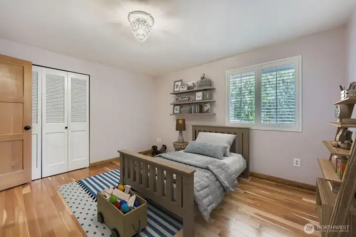 Whether adults or children inhabit this bedroom, they will be pleased with its spaciousness and the beautiful hardwood floors.