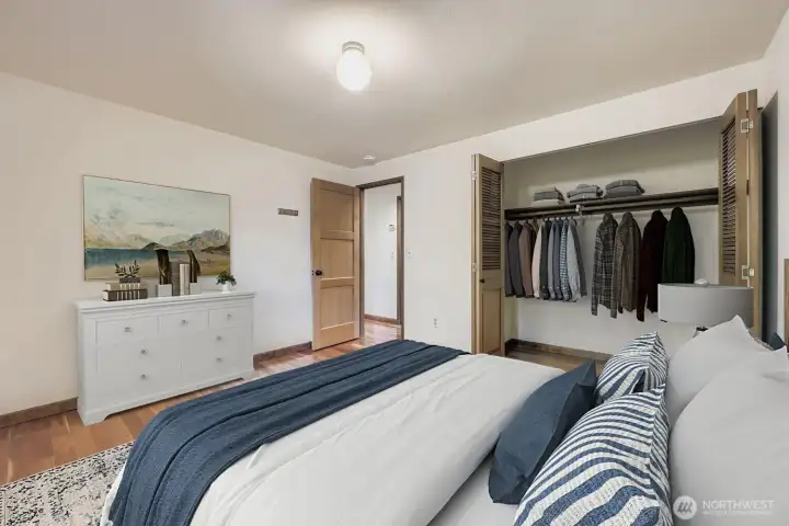 This third bedroom features ample closet space, gleaming hardwoods and a large window viewing the backyard. from this bedroom.