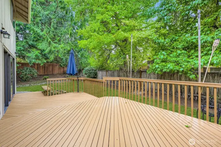 A brand new fence has been recently installed. The two-level spacious deck will make entertaining enjoyable with wonderful privacy created from the mature landscaping and trees.