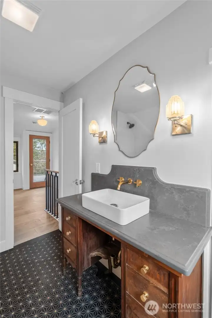 Black Marble floors, brass lights/mirror, tons of character and charm!