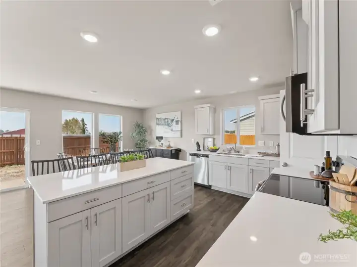 Kitchen overlooking dining room.  Finishes and options may vary.