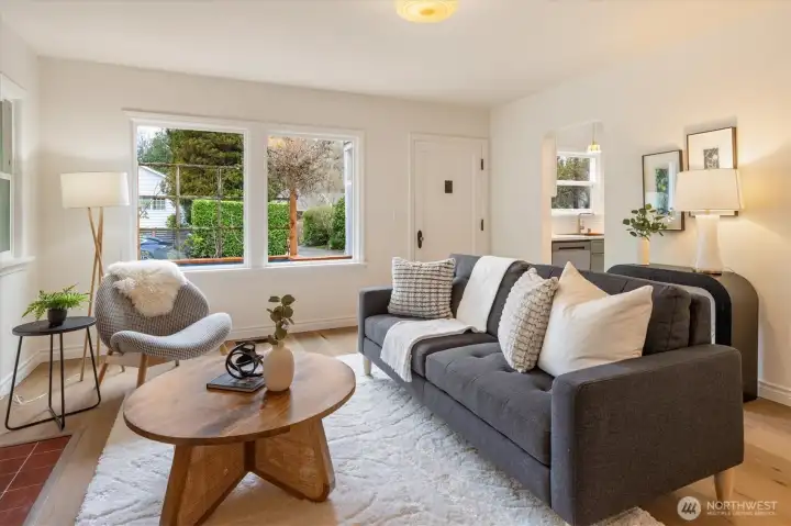 View of front door and window from living room.