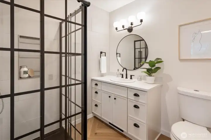 Primary suite's attached 3/4 bath.