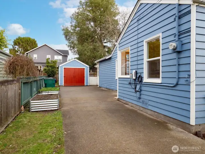 Detached garage at back of driveway.