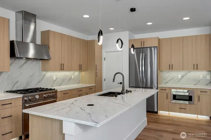 Massive kitchen (virtually staged, photo of similar home in separate community)
