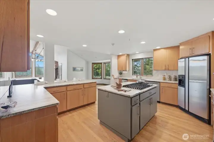 This Chef's Kitchen is ready for entertaining! Plenty of counterspace and cupboard storage. Just off the kitchen is   a large Utility Room/ Pantry Room combined and provides great storage space for all of those Kitchen gadgets.