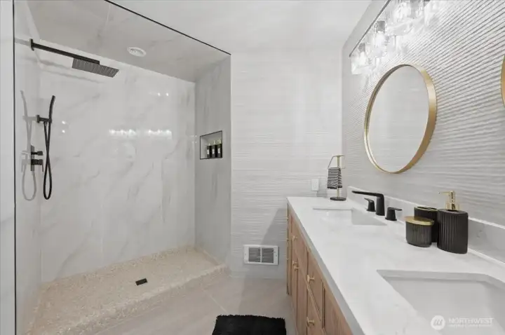 This Fully renovated primary Bath has Porcelain Tile throughout is GORGEOUS !!