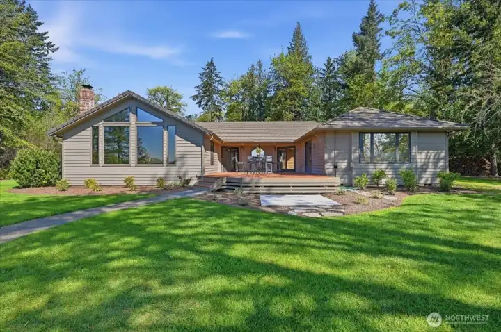 This very special home & property was truly designed for entertaining. Sliders open to the massive deck from the Primary Suite, the other 2 bedrooms, as well off of the Living room. ( note the Marble pad for a Spa/HotTub) hook up is at that space.   A Slab Marble pad & wiring are in place for a Spa, just off the deck.