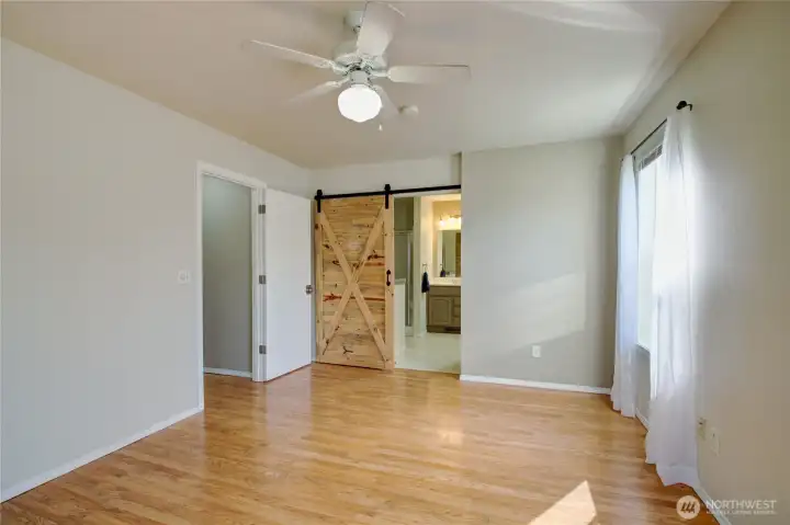 The master bath is through the sliding door.  It holds both a shower and a tub.