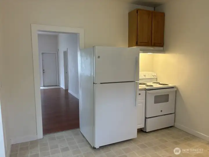 View from the kitchen toward the living room. All appliances stay! View from the kitchen toward the living room. All appliances stay!