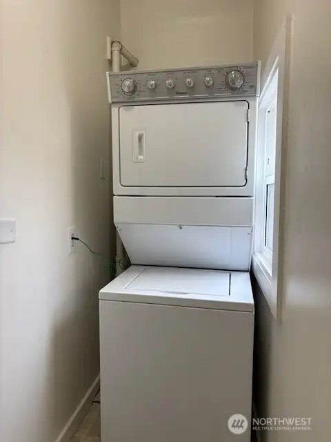 Newer stacked washer & dryer, all included! This utility room has a window to let the fresh air in. Newer stacked washer & dryer, all included! This utility room has a window to let the fresh air in.