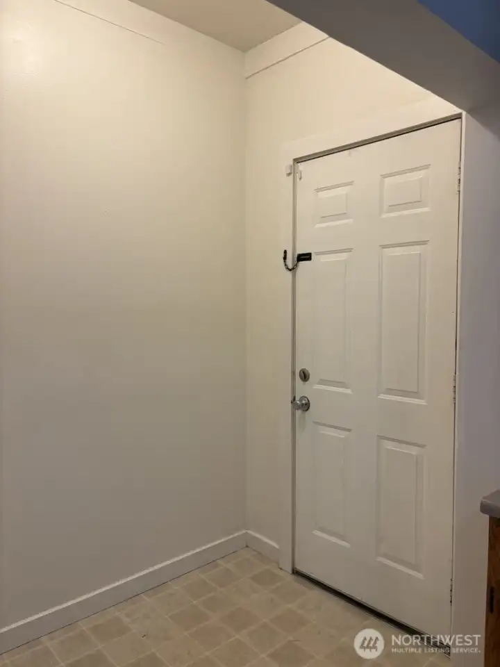 Go through the back door to the back yard and garage/workshop Go through the back door to the back yard and garage/workshop