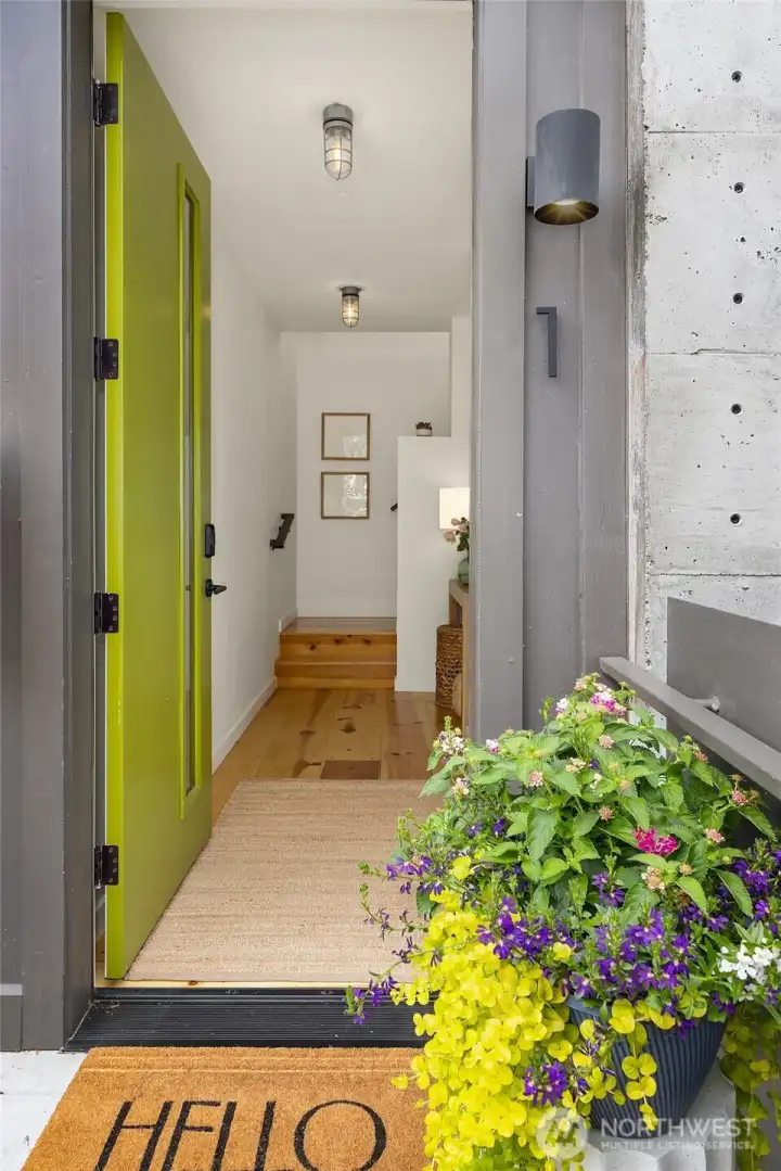 An exterior door on the 2nd floor opens into the 1-bedroom unit, which spans two levels in the building’s northwest corner.