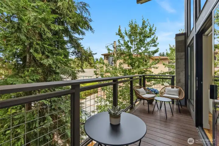 The generous covered deck expands the great room, providing space enough for both lounging and eating. The composite decking is low maintenance, comfortable to walk on, and easy to clean.